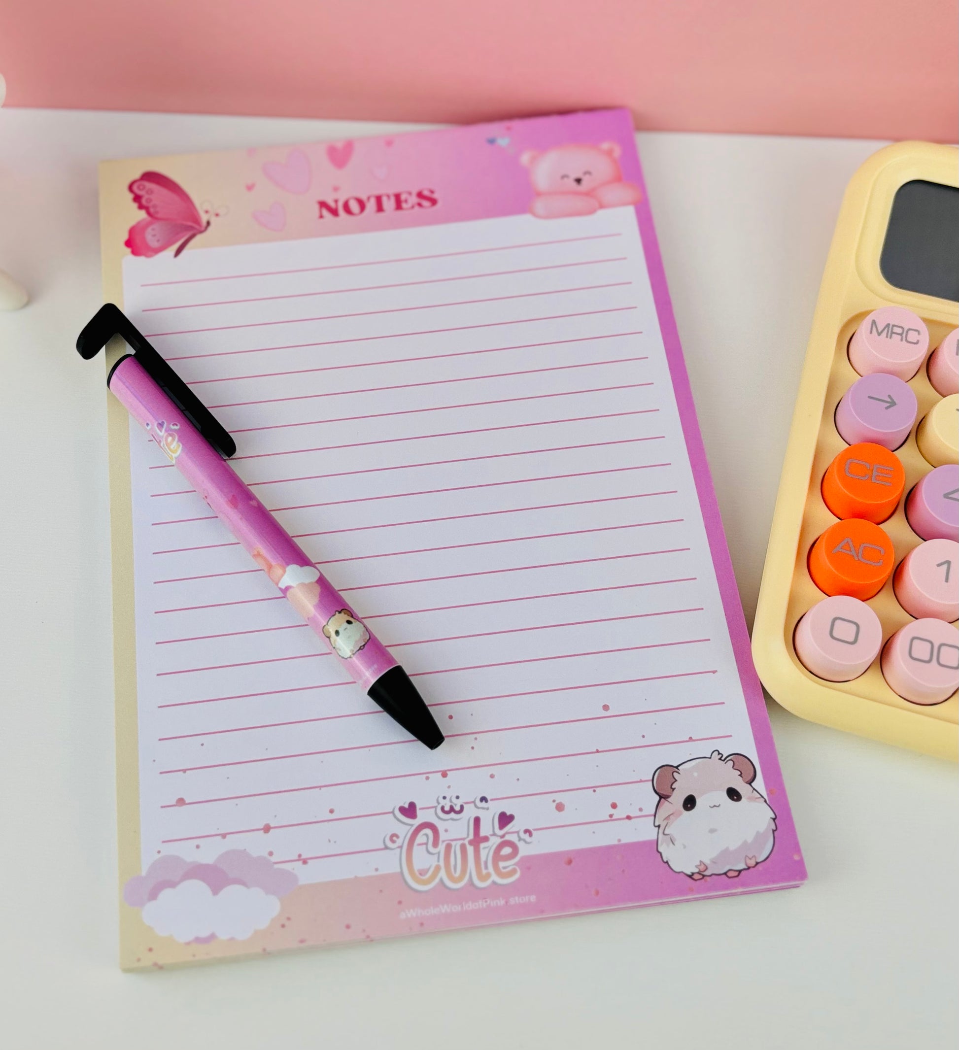 A5 Lined Note Pad Heavenly Pink Themed 50 Pages 120gsm, with Heavenly Pink themed Ballpoint pen and yellow calculator, butterflies, clouds and teddy bears